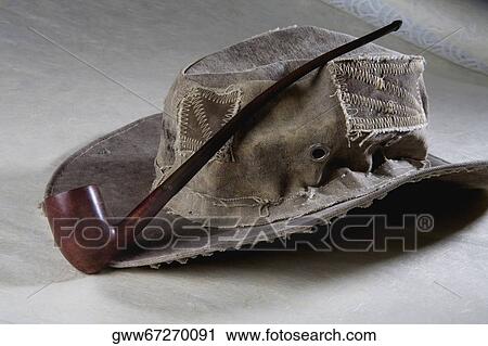 Close-up of a pipe with a sun hat View Large Photo Image Stock Image - Close-up of a pipe with a sun hat. Fotosearch