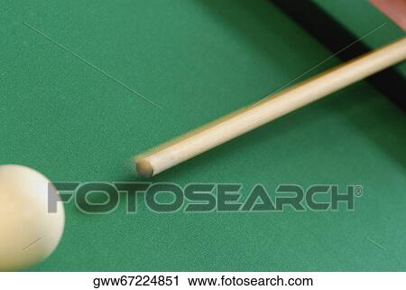 Close-up of a pool cue hitting a pool ball View Large Photo Image Stock Image - Close-up of a pool cue hitting a pool ball. Fotosearch