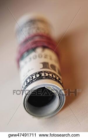 Close-up of a roll of one hundred dollar bills View Large Photo Image Stock Image - Close-up of a roll of one hundred dollar bills. Fotosearch