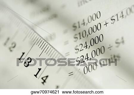 Close-up of a ruler with a financial document View Large Photo Image Stock Image - Close-up of a ruler with a financial document. Fotosearch