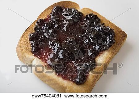 Close-up of a slice of bread with jam View Large Photo Image Stock Image - Close-up of a slice of bread with jam. Fotosearch