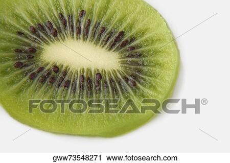 Close-up of a slice of kiwi View Large Photo Image Stock Image - Close-up of a slice of kiwi. Fotosearch