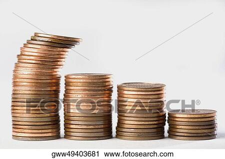 Stock Image - Close-up of a stack of coins in a row. Fotosearch