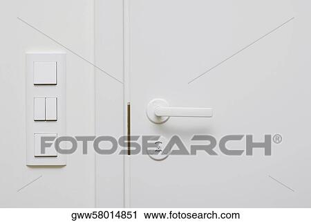 Close-up of a switch near a closed door View Large Photo Image Stock Image - Close-up of a switch near a closed door. Fotosearch