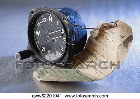 Close-up of a tag attached to a broken compass View Large Photo Image Stock Image - Close-up of a tag attached to a broken compass. Fotosearch