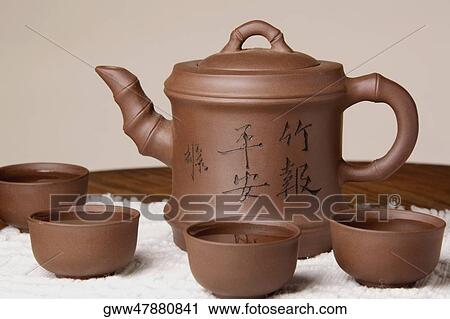 Close-up of a tea kettle with tea cups View Large Photo Image Stock Image - Close-up of a tea kettle with tea cups. Fotosearch