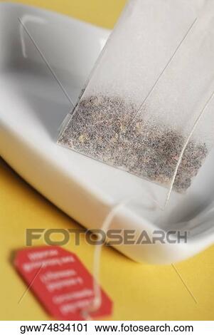 Stock Image - Close-up of a teabag on a tray. Fotosearch