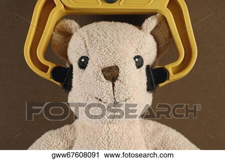 Close-up of a teddy bear held by a robotic arm View Large Photo Image Stock Image - Close-up of a teddy bear held by a robotic arm. Fotosearch