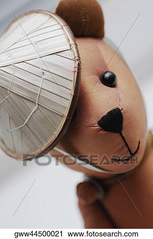 Close-up of a teddy bear wearing an asian style conical hat View Large Photo Image Stock Image - Close-up of a teddy bear wearing an asian style conical hat. Fotosearch