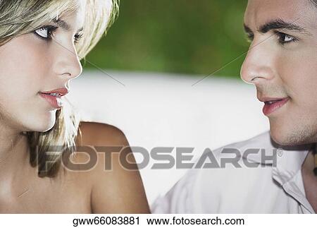 Close-up of a teenage boy looking at a young woman View Large Photo Image Stock Image - Close-up of a teenage boy looking at a young woman. Fotosearch
