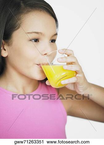 Close-up of a teenage girl drinking juice View Large Photo Image Stock Image - Close-up of a teenage girl drinking juice. Fotosearch