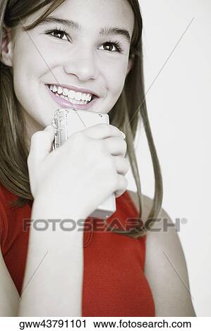Close-up of a teenage girl listening to a tape recorder View Large Photo Image Stock Image - Close-up of a teenage girl listening to a tape recorder. Fotosearch