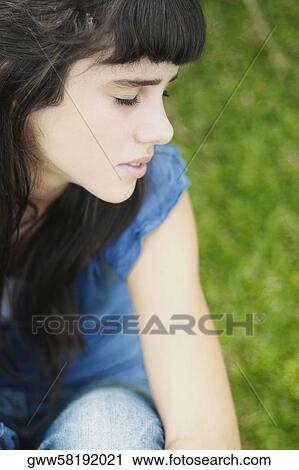 Close-up of a teenage girl sitting with her eyes closed View Large Photo Image Stock Image - Close-up of a teenage girl sitting with her eyes closed. Fotosearch