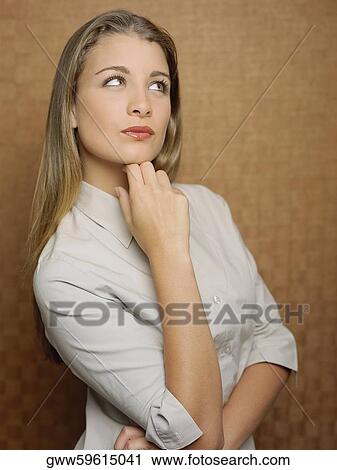 Close-up of a teenage girl with her hand on her chin View Large Photo Image Stock Image - Close-up of a teenage girl with her hand on her chin. Fotosearch