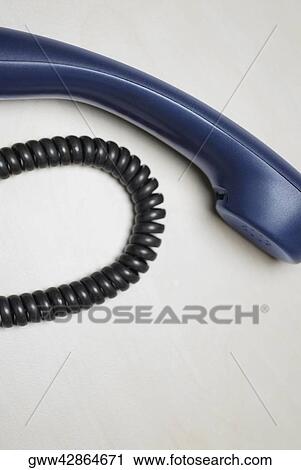 Close-up of a telephone receiver with a phone cord View Large Photo Image Stock Image - Close-up of a telephone receiver with a phone cord. Fotosearch