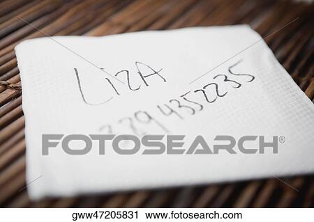 Close-up of a tissue paper on a bamboo mat View Large Photo Image Stock Image - Close-up of a tissue paper on a bamboo mat. Fotosearch