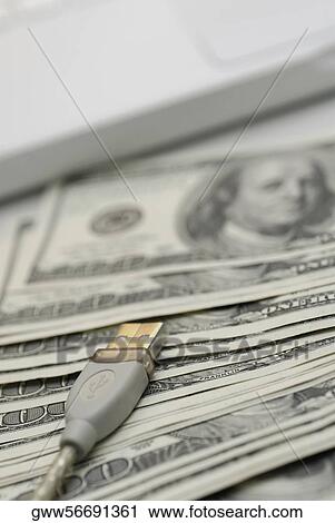 Close-up of a USB cable on one hundred US dollar Bills View Large Photo Image Stock Image - Close-up of a USB cable on one hundred US dollar Bills. Fotosearch