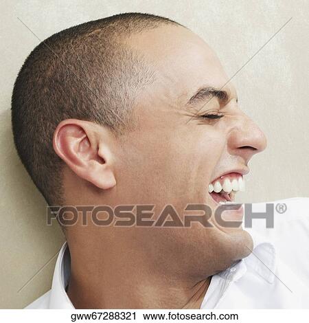 Close-up of a young man smiling with his eyes closed View Large Photo Image Stock Image - Close-up of a young man smiling with his eyes closed. Fotosearch