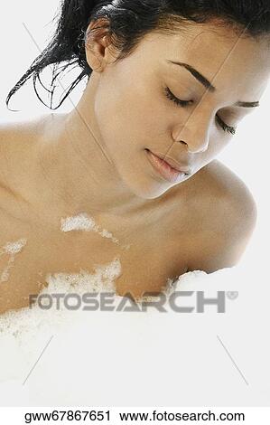 Close-up of a young woman in a bathtub View Large Photo Image Stock Image - Close-up of a young woman in a bathtub. Fotosearch