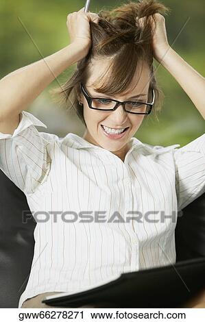 Stock Image - Close-up of a young woman smiling. Fotosearch
