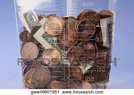 Stock Image - Close-up of American currency in a jar. Fotosearch