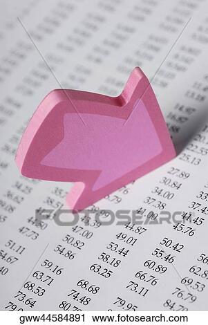 Close-up of an arrow on a financial page View Large Photo Image Stock Image - Close-up of an arrow on a financial page. Fotosearch