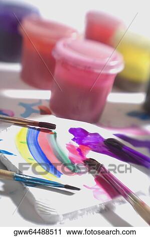 Stock Image - Close-up of brushes with watercolor paints. Fotosearch