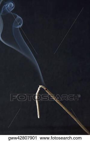 Stock Image - Close-up of burning incense. Fotosearch
