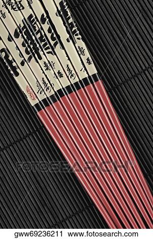 Close-up of chopsticks on a mat View Large Photo Image Stock Image - Close-up of chopsticks on a mat. Fotosearch
