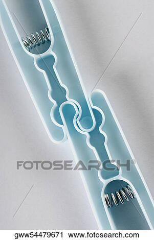 Stock Image - Close-up of clothespins. Fotosearch