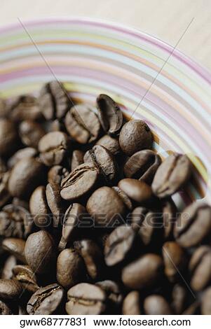 Close-up of coffee beans in a bowl View Large Photo Image Stock Image - Close-up of coffee beans in a bowl. Fotosearch
