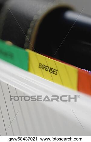 Close-up of expenses symbol of a personal organizer View Large Photo Image Stock Image - Close-up of expenses symbol of a personal organizer. Fotosearch