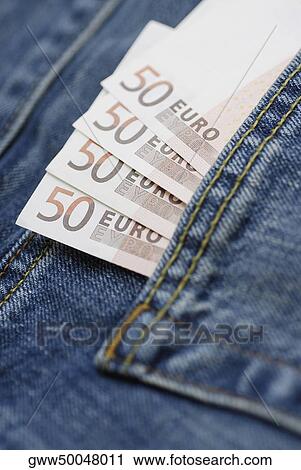 Close-up of fifty Euro banknotes tucked into a back pocket View Large Photo Image Stock Image - Close-up of fifty Euro banknotes tucked into a back pocket. Fotosearch