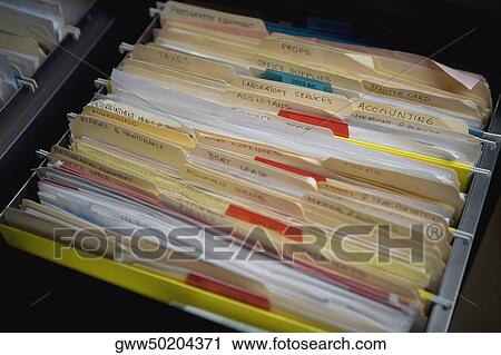 Stock Image - Close-up of files in a file cabinet. Fotosearch