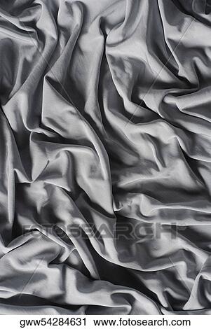 Close-up of folds of a silky fabric View Large Photo Image Stock Image - Close-up of folds of a silky fabric. Fotosearch