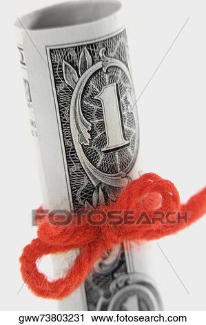Close-up of one dollar bill rolled and tied with string View Large Photo Image Stock Image - Close-up of one dollar bill rolled and tied with string. Fotosearch