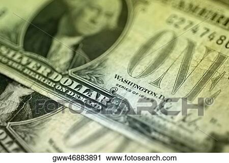 Stock Image - Close-up of one hundred dollar bank notes. Fotosearch