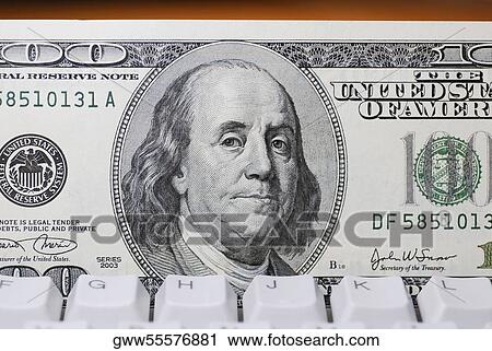 Close-up of one hundred dollar bill on a computer keyboard View Large Photo Image Stock Image - Close-up of one hundred dollar bill on a computer keyboard. Fotosearch