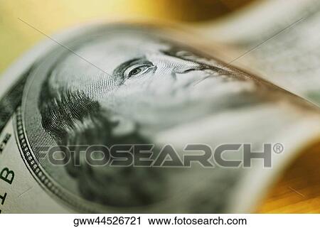 Stock Image - Close-up of one hundred dollar bill. Fotosearch