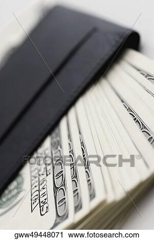 Close-up of one hundred dollar bills in a wallet View Large Photo Image Stock Image - Close-up of one hundred dollar bills in a wallet. Fotosearch