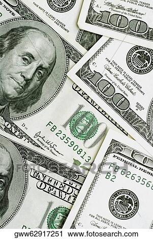 Stock Image - Close-up of one hundred dollar bills. Fotosearch