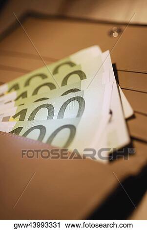 Close-up of one hundred Euro banknotes in a purse View Large Photo Image Stock Image - Close-up of one hundred Euro banknotes in a purse. Fotosearch