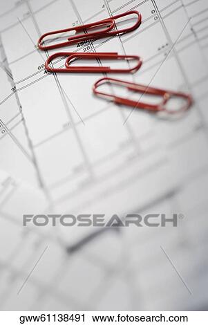 Close-up of paper clips on documents View Large Photo Image Stock Image - Close-up of paper clips on documents. Fotosearch