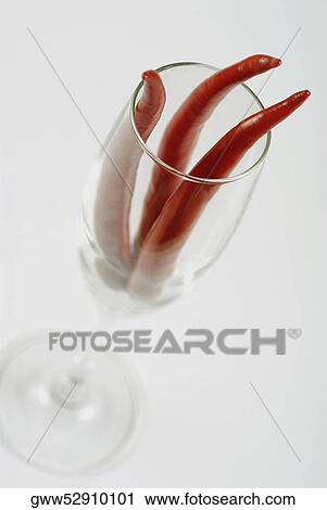 Close-up of red chili peppers in a stem glass View Large Photo Image Stock Image - Close-up of red chili peppers in a stem glass. Fotosearch