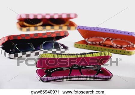 Close-up of spectacle cases with eyeglasses View Large Photo Image Stock Image - Close-up of spectacle cases with eyeglasses. Fotosearch