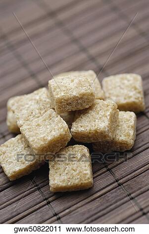 Stock Image - Close-up of sugar cubes. Fotosearch