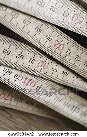 Stock Image - Close-up of tape measures. Fotosearch