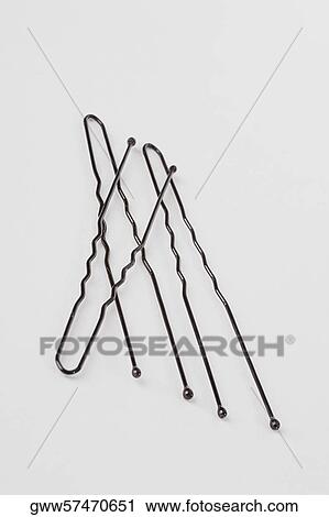 Stock Image - Close-up of three hairpins. Fotosearch