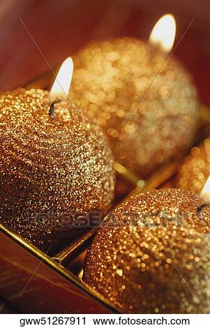 Close-up of three lit candles View Large Photo Image Stock Image - Close-up of three lit candles. Fotosearch