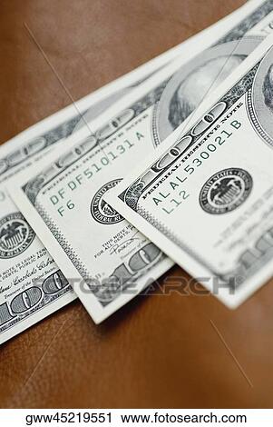 Close-up of three one hundred dollar bills View Large Photo Image Stock Image - Close-up of three one hundred dollar bills. Fotosearch
